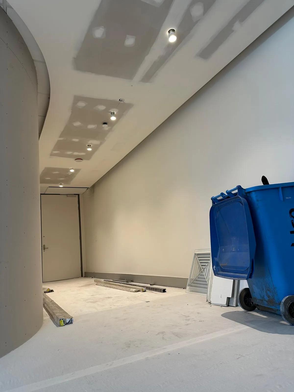 Ongoing ceiling light installation at a commercial site in Sydney with recessed lighting fixtures