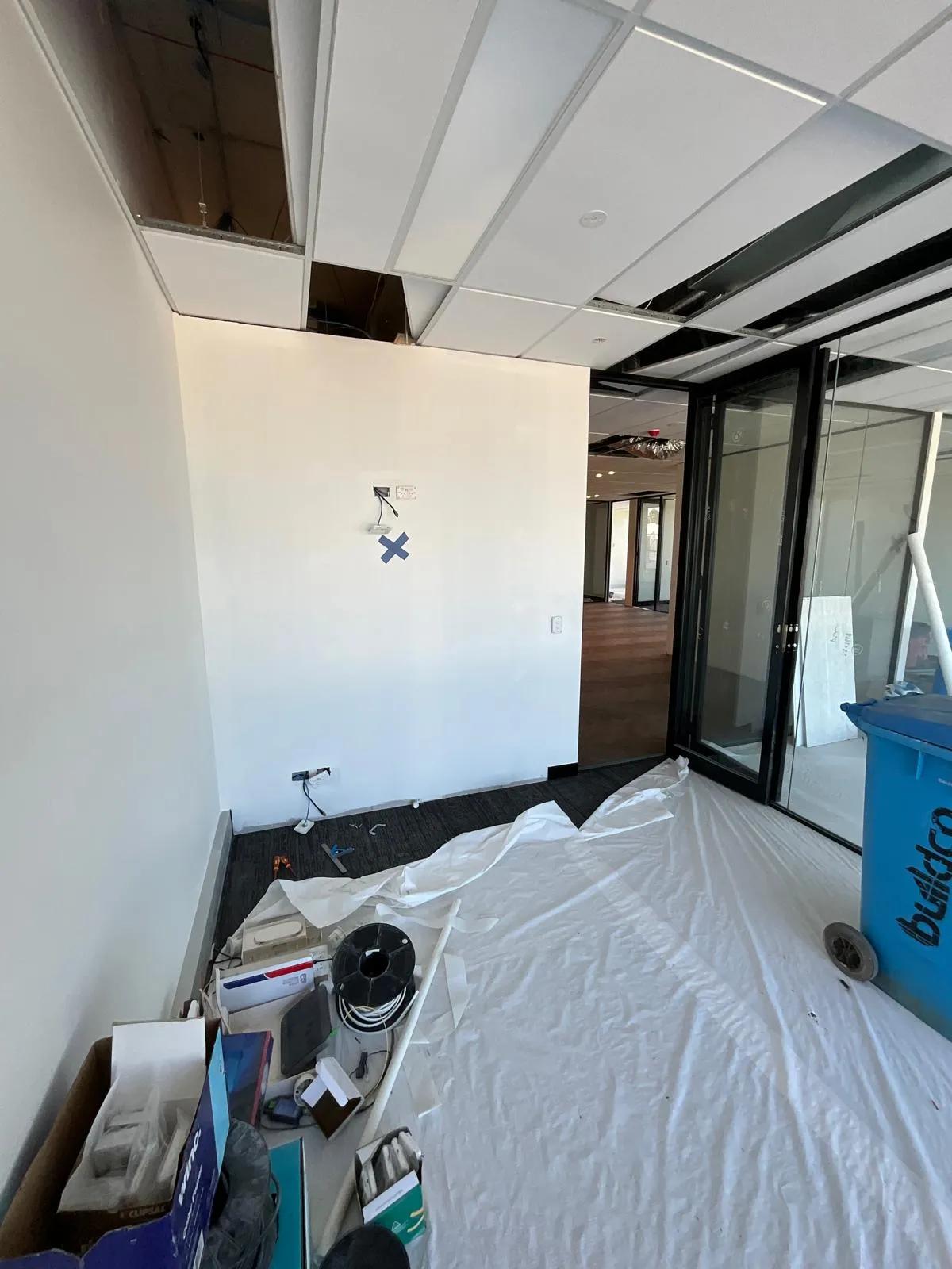 Office wiring and ceiling installation in progress at a commercial property in Sydney